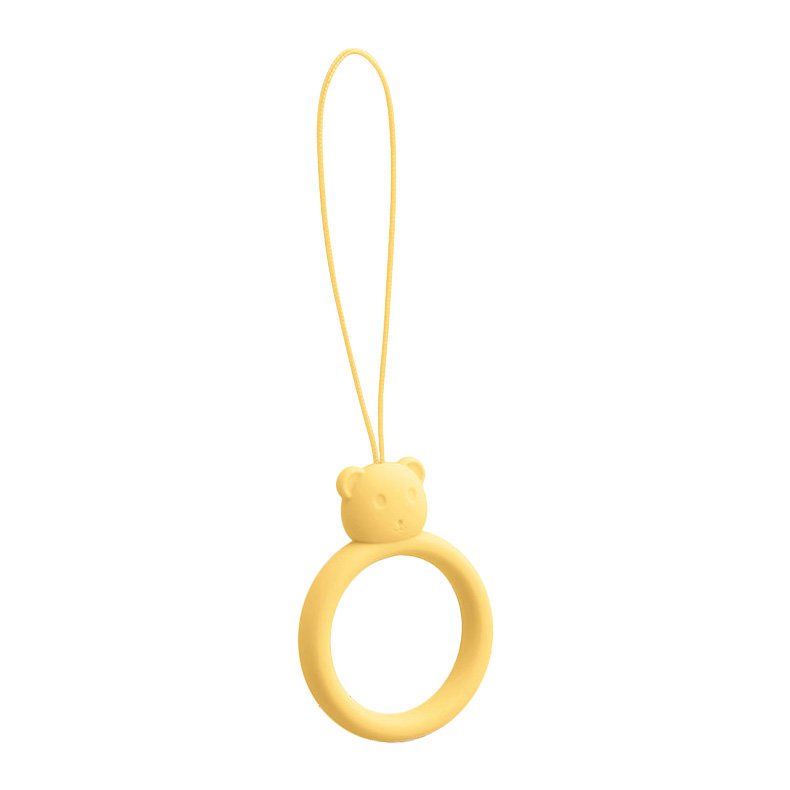 Um cordão de silicone para um anel de urso de telefone em um dedo amarelo